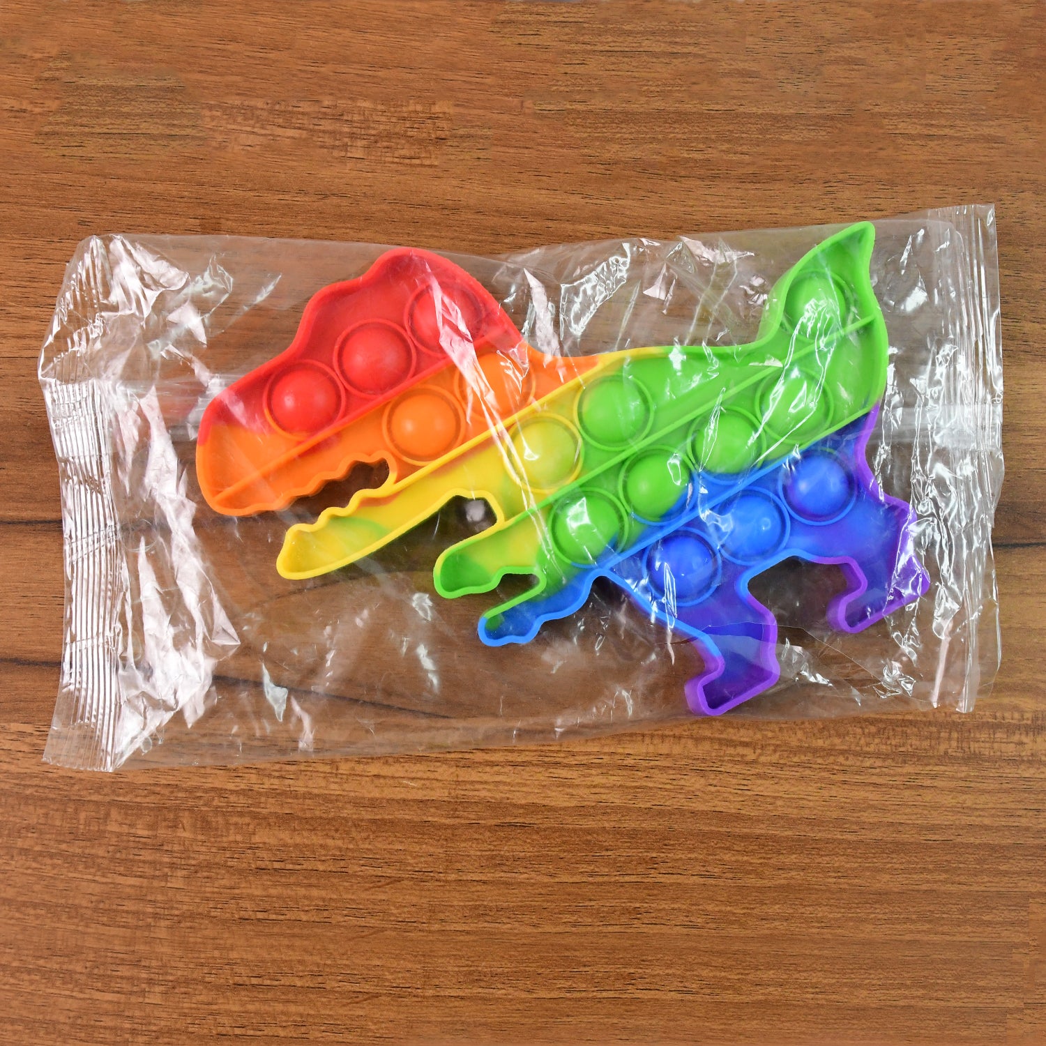 Dinosaur Shaped Rainbow Pop It Fidget Toy (1 Pc) Dinosaur Shaped Rainbow Pop It Fidget Toy (1 Pc)